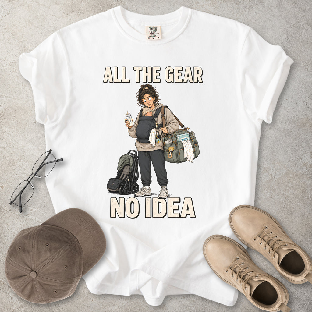 White Comfort Colors 1717 T-shirt with a funny All the Gear No Idea new mum graphic showing a tired mother carrying a baby, bottle, changing bag and stroller.