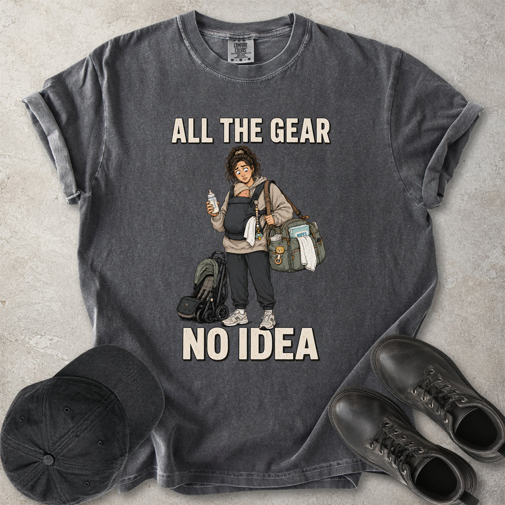 Pepper grey Comfort Colors 1717 T-shirt with a funny All the Gear No Idea new mum graphic showing a tired mother carrying a baby, bottle, changing bag and stroller.