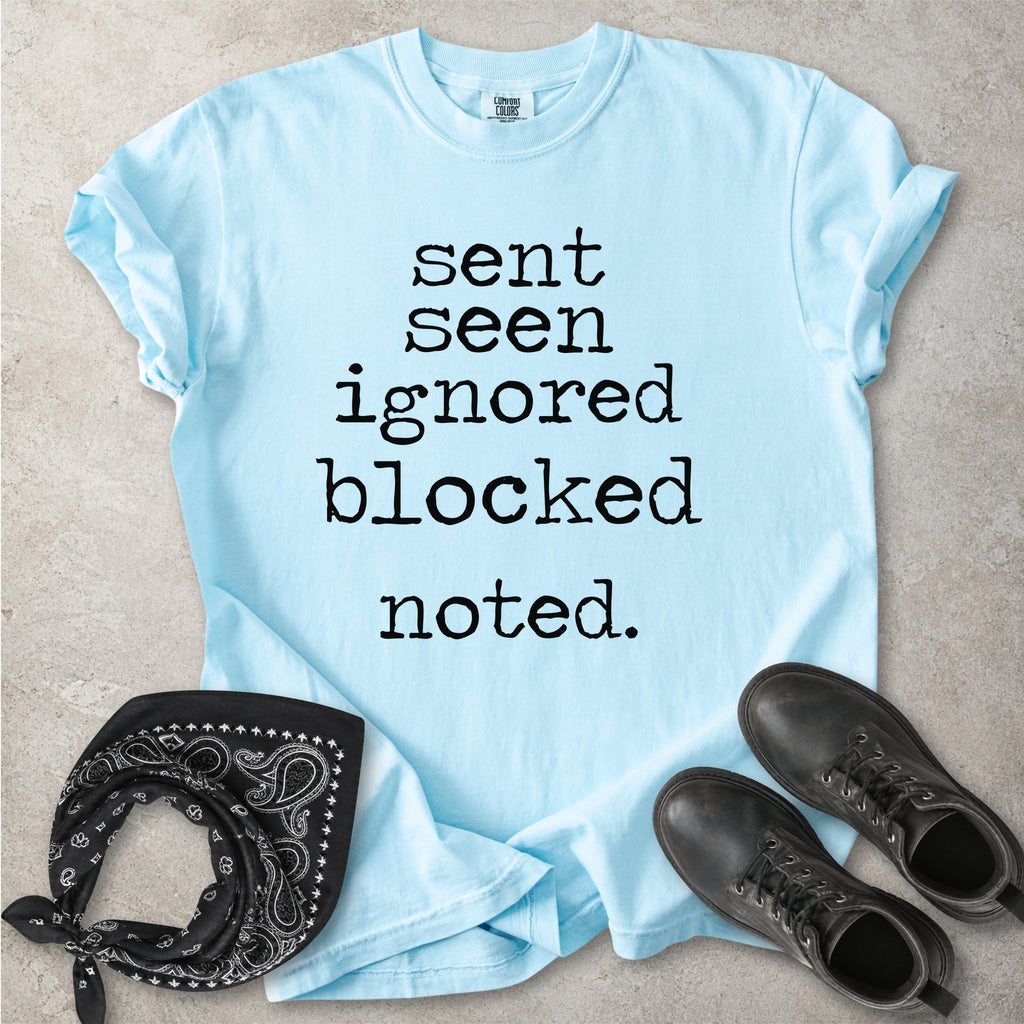 Chambray light blue Comfort Colors graphic T-shirt with black text reading sent seen ignored blocked noted, styled with black boots and a black bandana