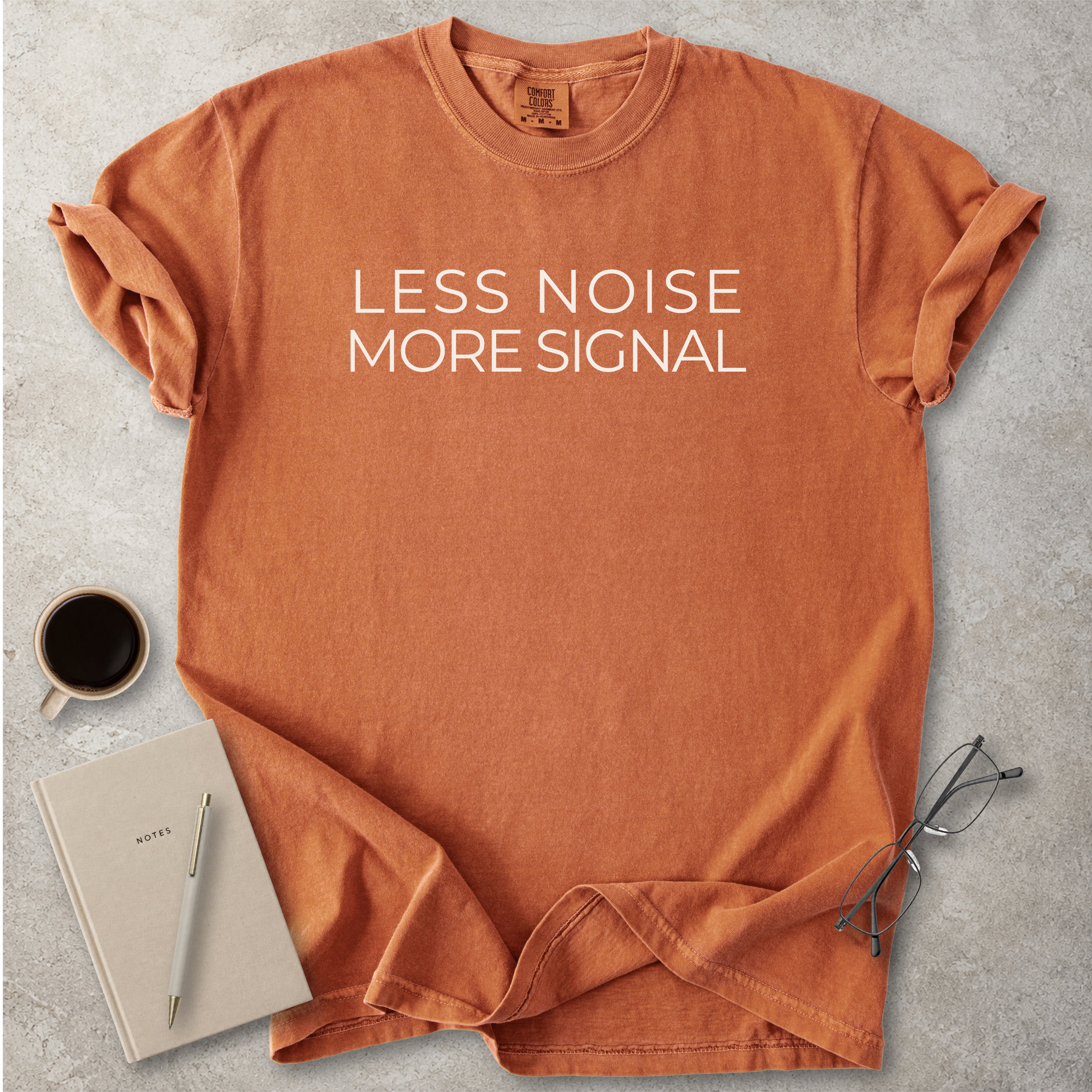 Yam orange Comfort Colors graphic T-shirt with black text reading wyd omw brb nvm typical, styled with black boots and a black bandana