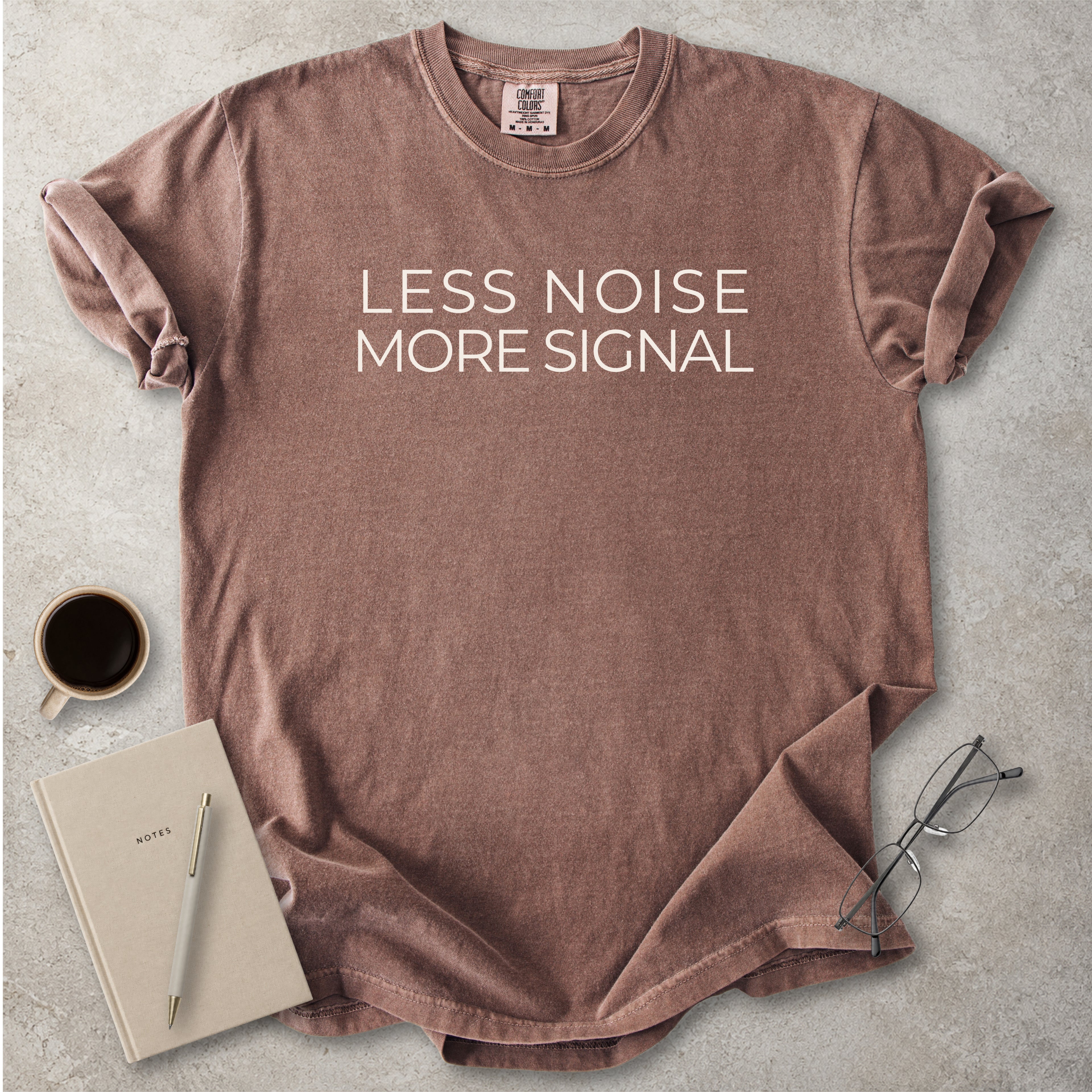 Espresso brown Comfort Colors graphic T-shirt with black text reading wyd omw brb nvm typical, styled with black boots and a black bandana