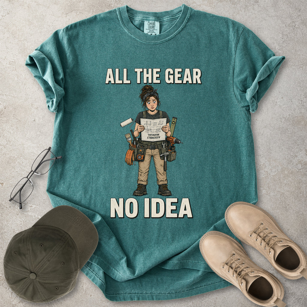Blue spruce green Comfort Colors 1717 T-shirt with a funny All the Gear No Idea DIY graphic showing a woman with tools holding an upside-down assembly manual.