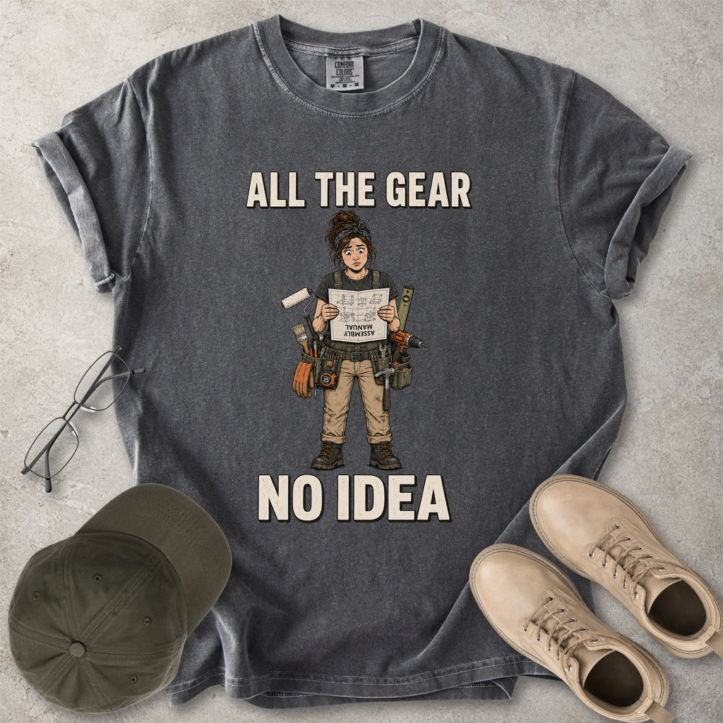 Pepper grey Comfort Colors 1717 T-shirt with a funny All the Gear No Idea DIY graphic showing a woman with tools holding an upside-down assembly manual.