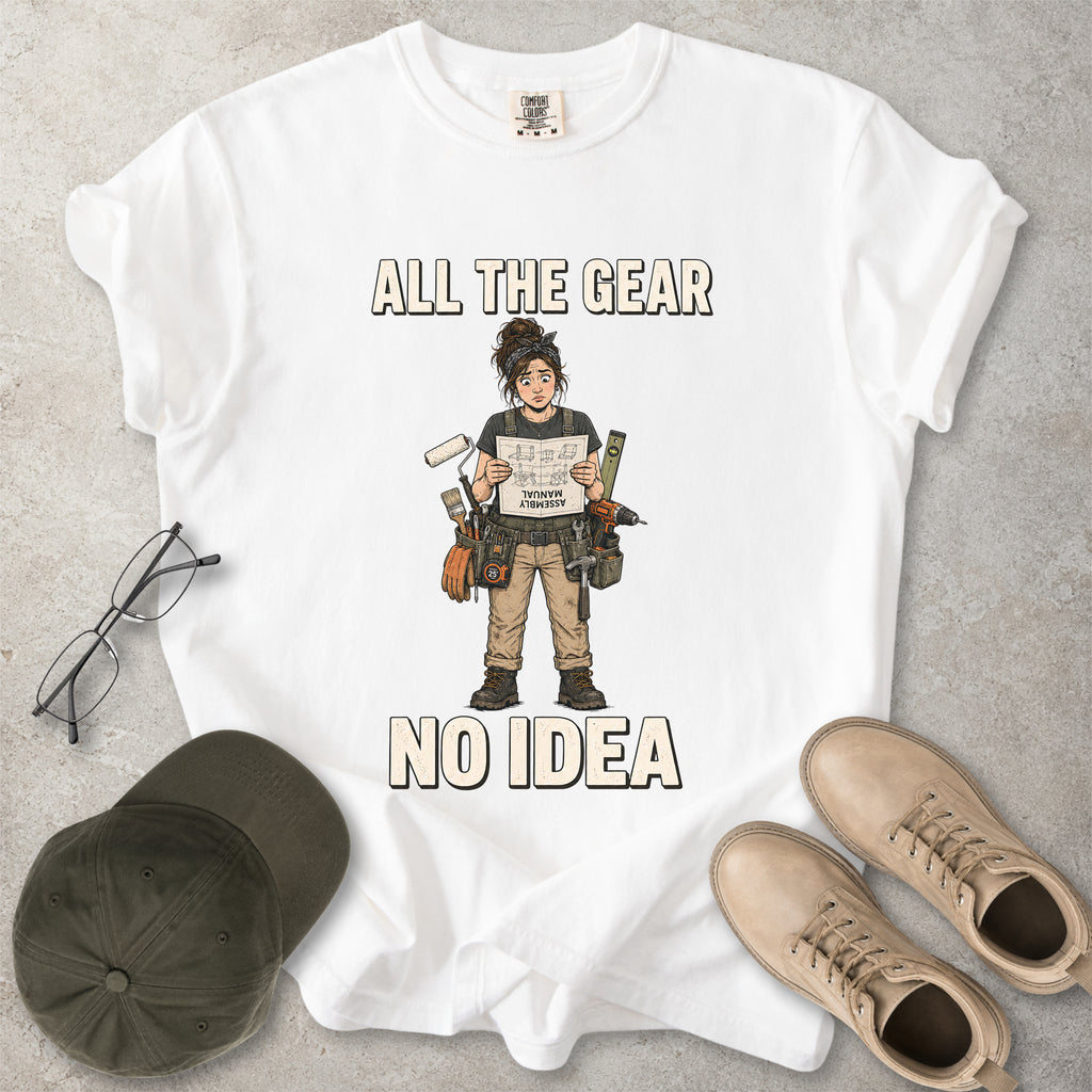 White Comfort Colors 1717 T-shirt with a funny All the Gear No Idea DIY graphic showing a woman with tools holding an upside-down assembly manual.