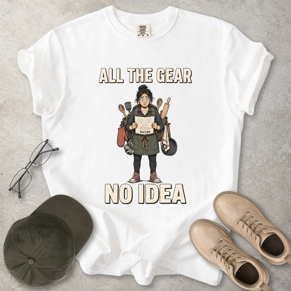 White Comfort Colors 1717 T-shirt with a funny All the Gear No Idea cooking graphic showing a woman holding an upside-down recipe with kitchen utensils.
