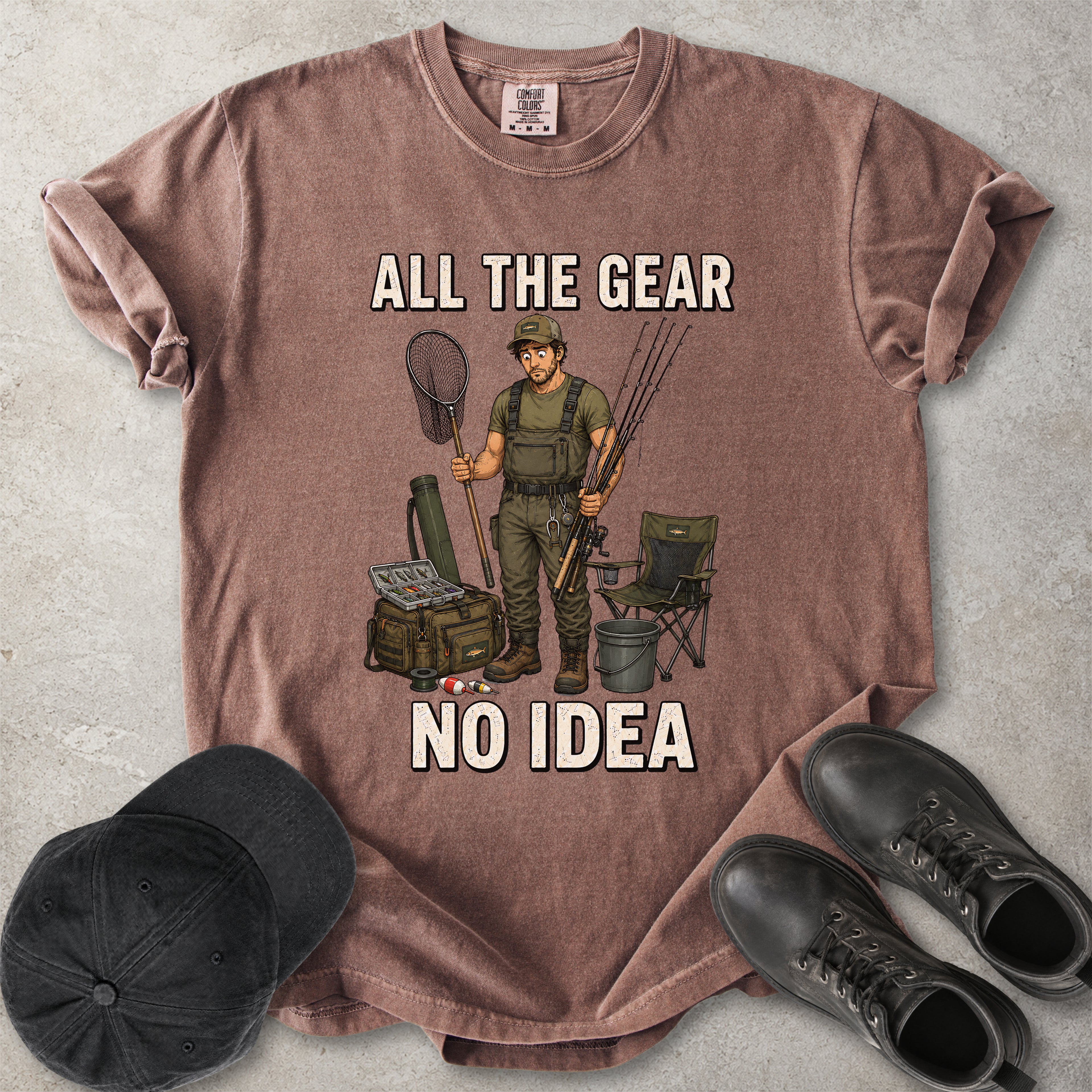 Espresso brown Comfort Colors 1717 T-shirt with a funny All the Gear No Idea fishing graphic showing a confused fisherman holding rods and a landing net with fishing gear.