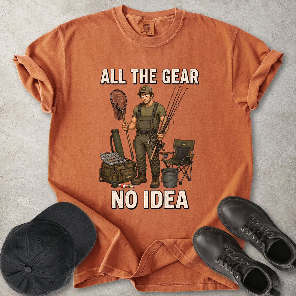 Yam orange Comfort Colors 1717 T-shirt with a funny All the Gear No Idea fishing graphic showing a confused fisherman holding rods and a landing net with fishing gear.