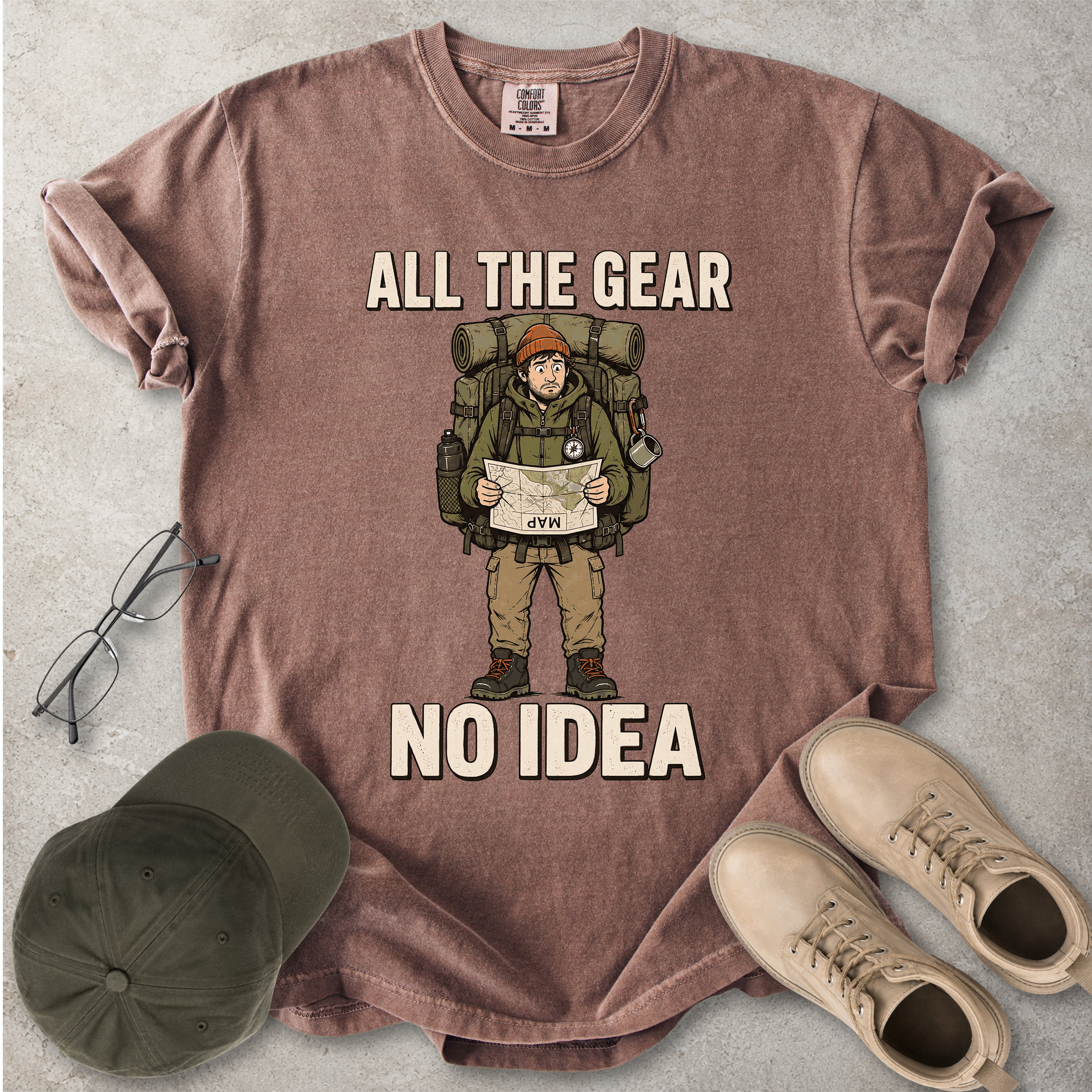 Espresso brownComfort Colors 1717 T-shirt with a funny All the Gear No Idea hiking graphic showing a confused hiker holding an upside-down map with a large backpack.