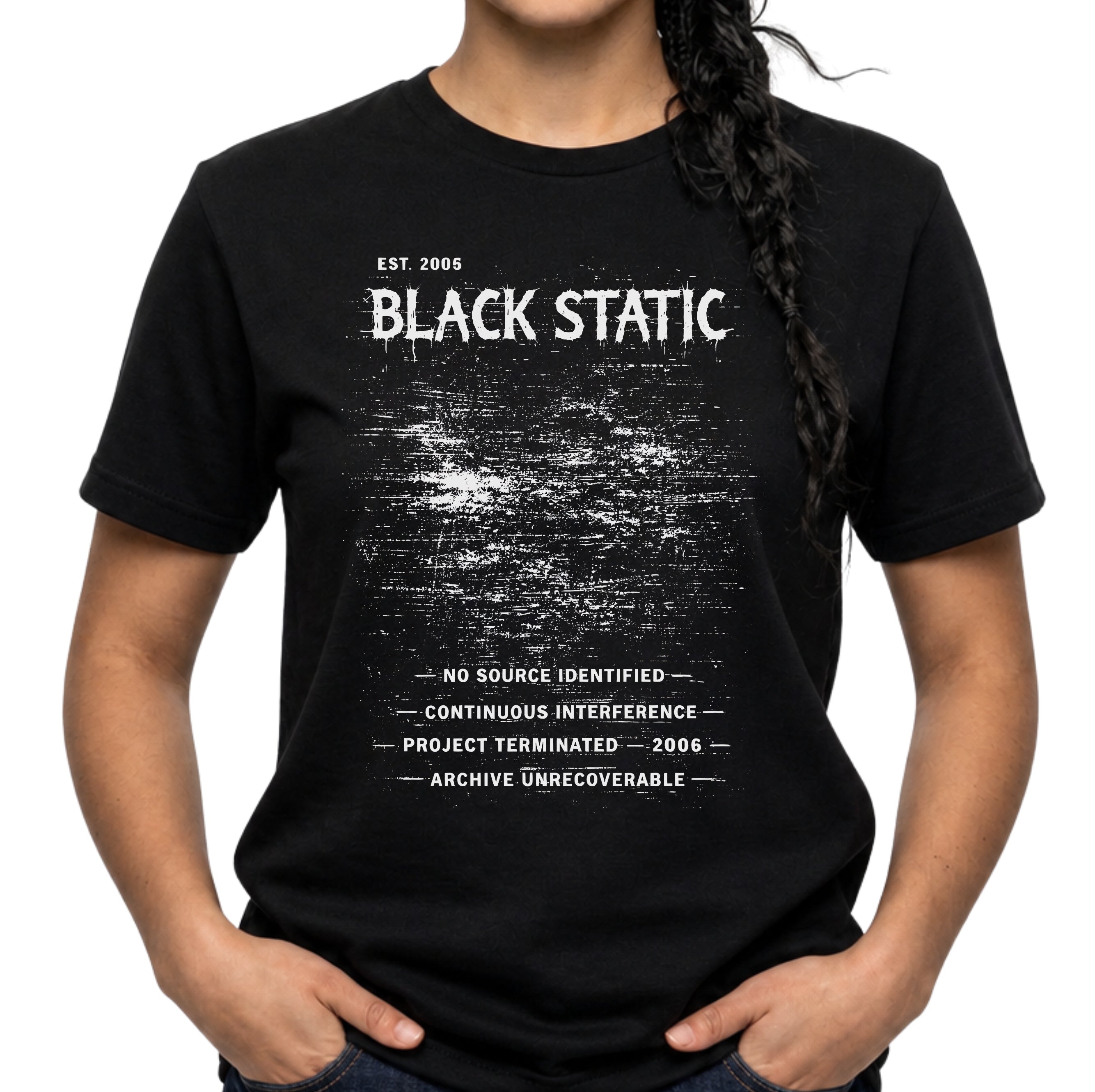 Black Static graphic T-shirt with distressed white typography and static noise artwork on black. A dark archive-band style tee for glitch, cyber grunge, and underground streetwear fans.