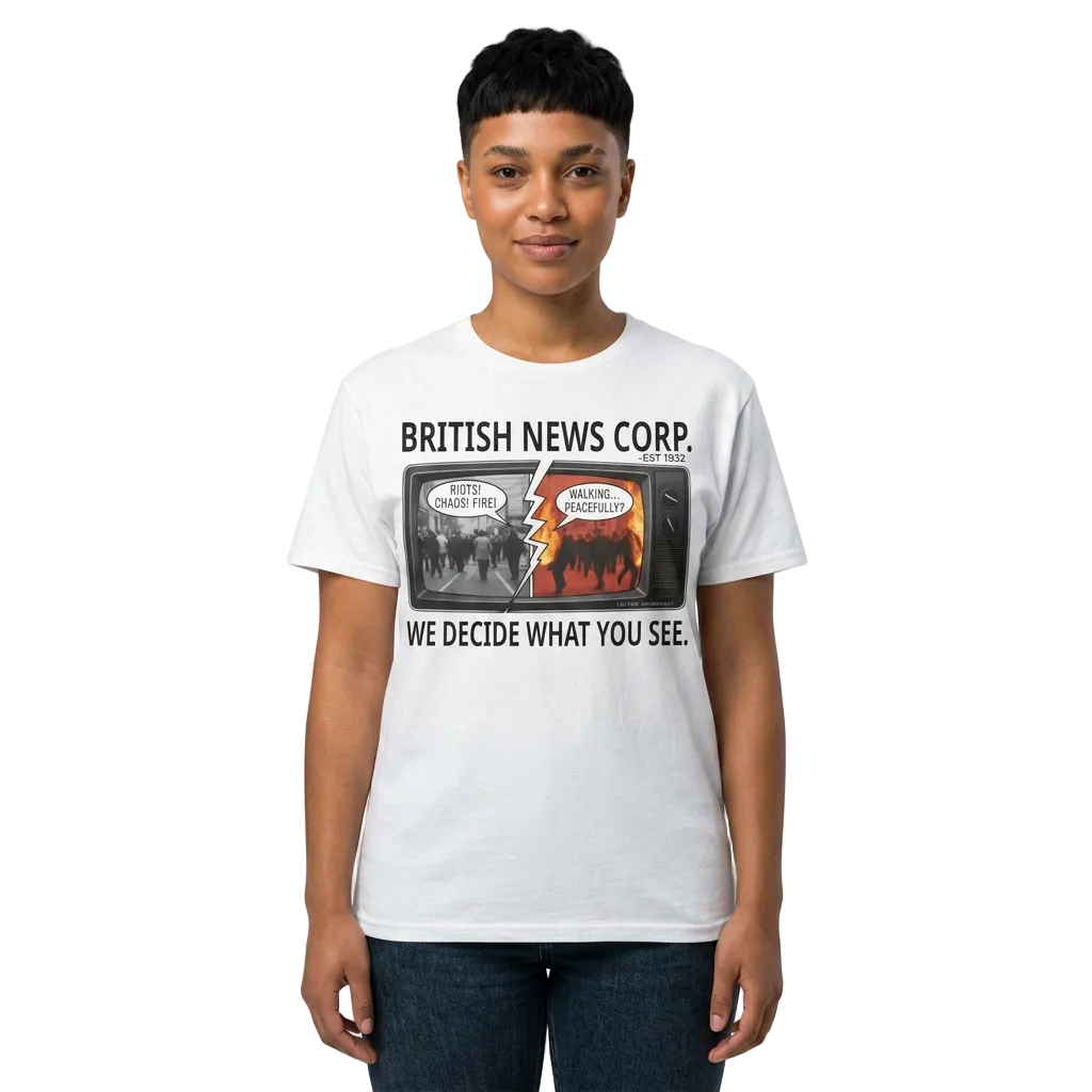 Model wearing a British News Corp media satire tee with split TV news artwork about media bias and headline framing.