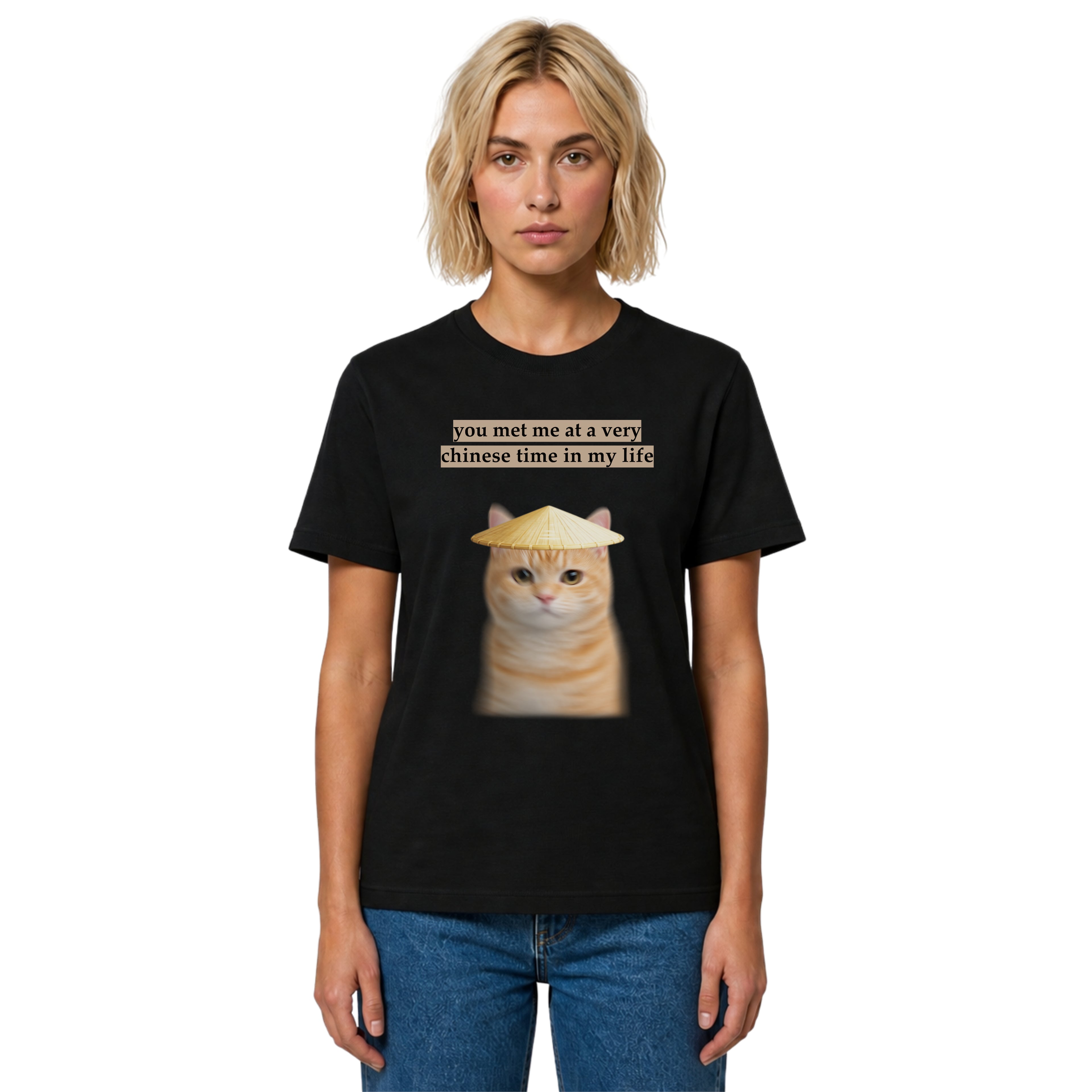 Person wearing a black t-shirt with a cat graphic and text on a white background