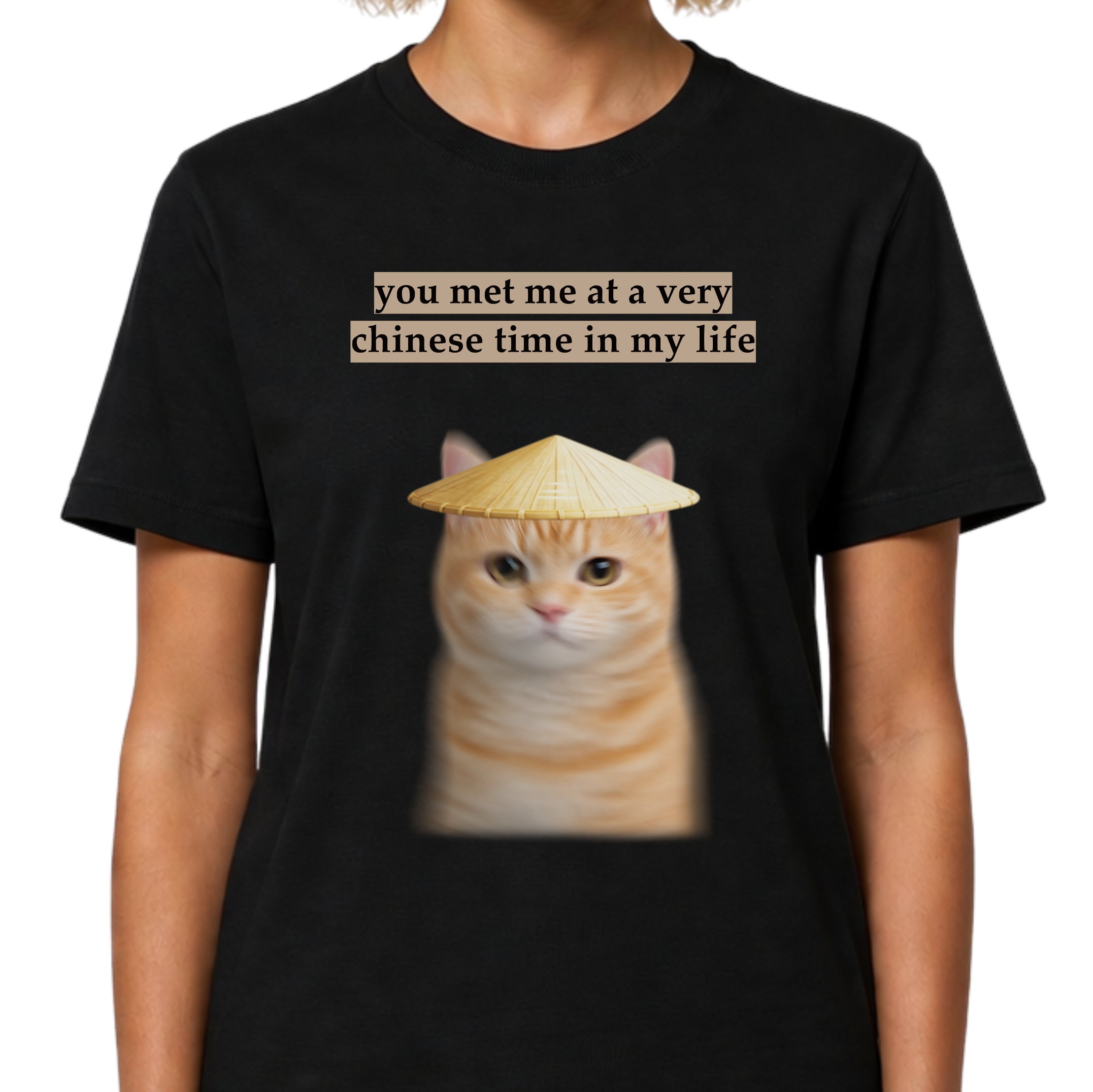 Black t-shirt with a cat wearing a conical hat and text on a white background