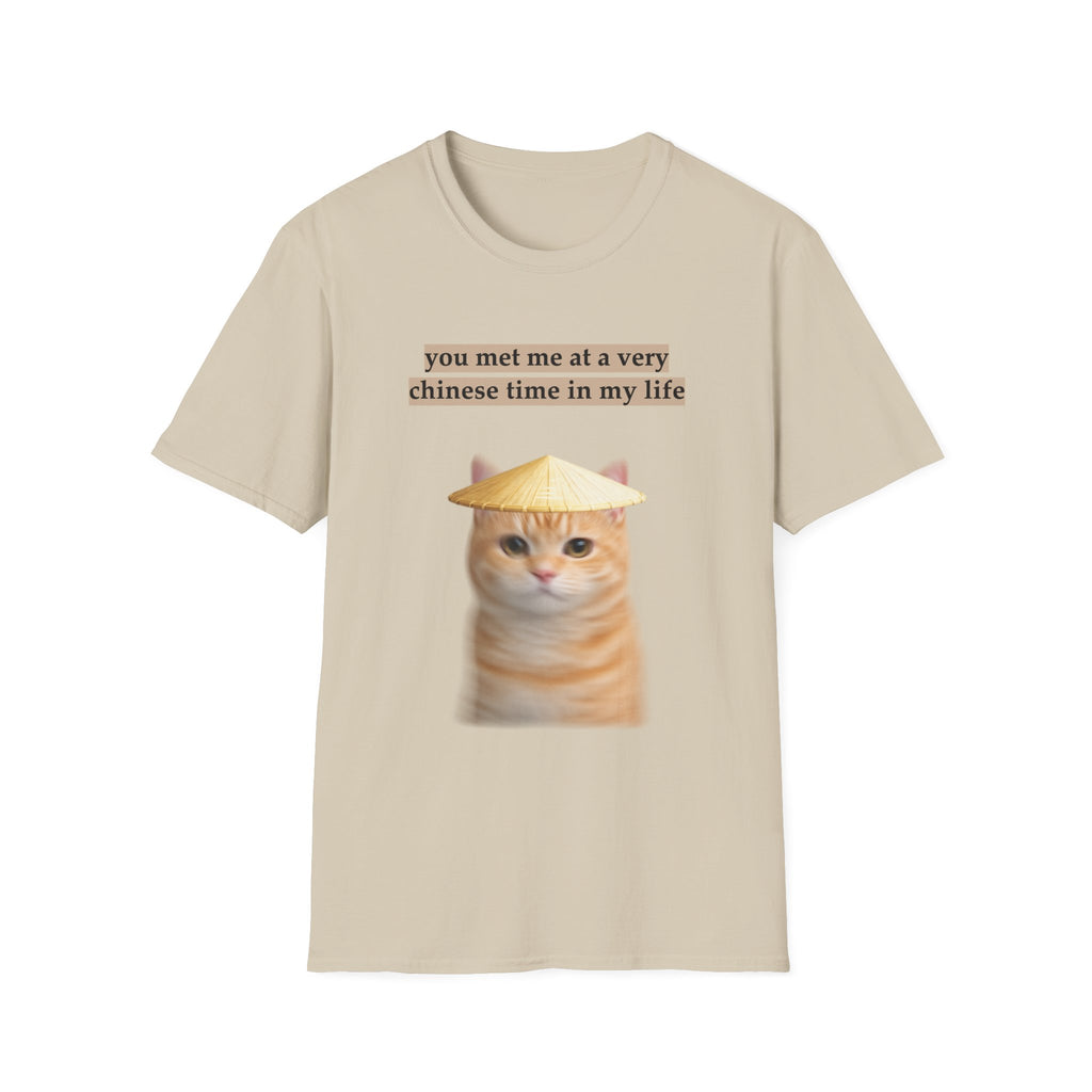 Beige t-shirt with a cat graphic and text on a white background