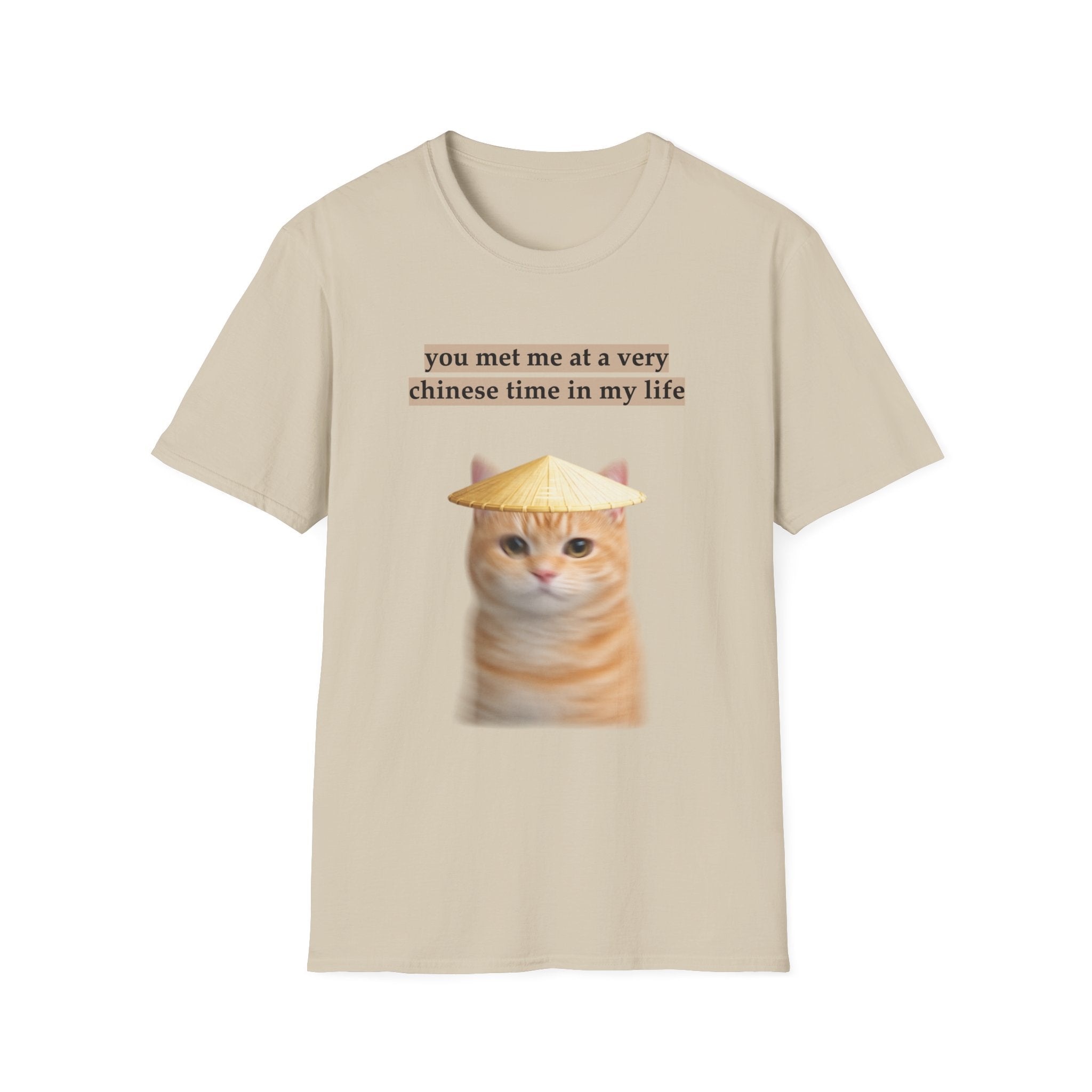 Beige t-shirt with a cat graphic and text on a white background