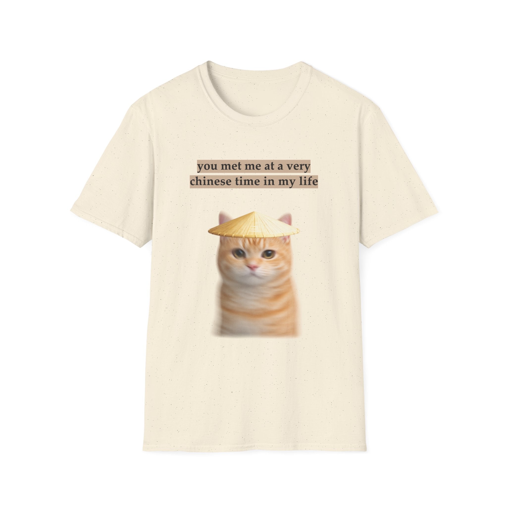 Beige t-shirt with a cat graphic and text on a white background