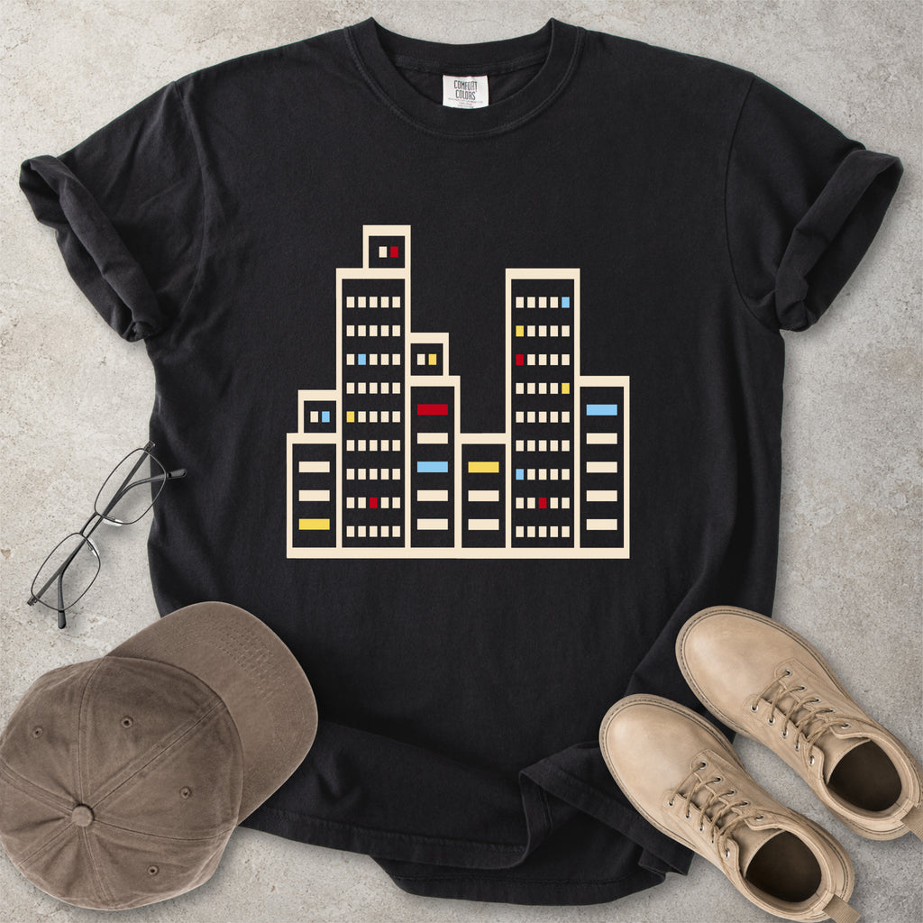 Black Comfort Colors graphic T-shirt with a minimalist cityscape window design, styled with glasses, cap and tan boots