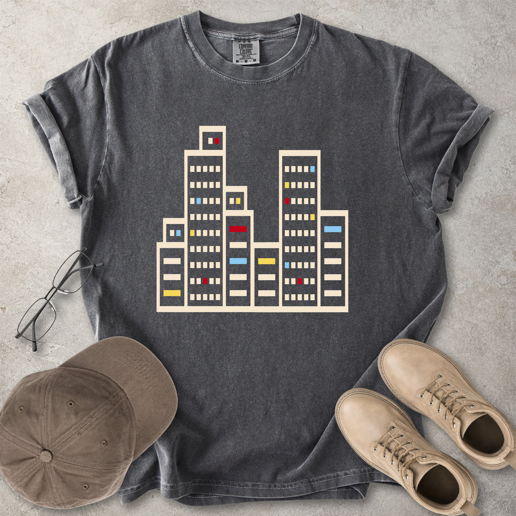 Pepper grey Comfort Colors graphic T-shirt with a minimalist cityscape window design, styled with glasses, cap and tan boots