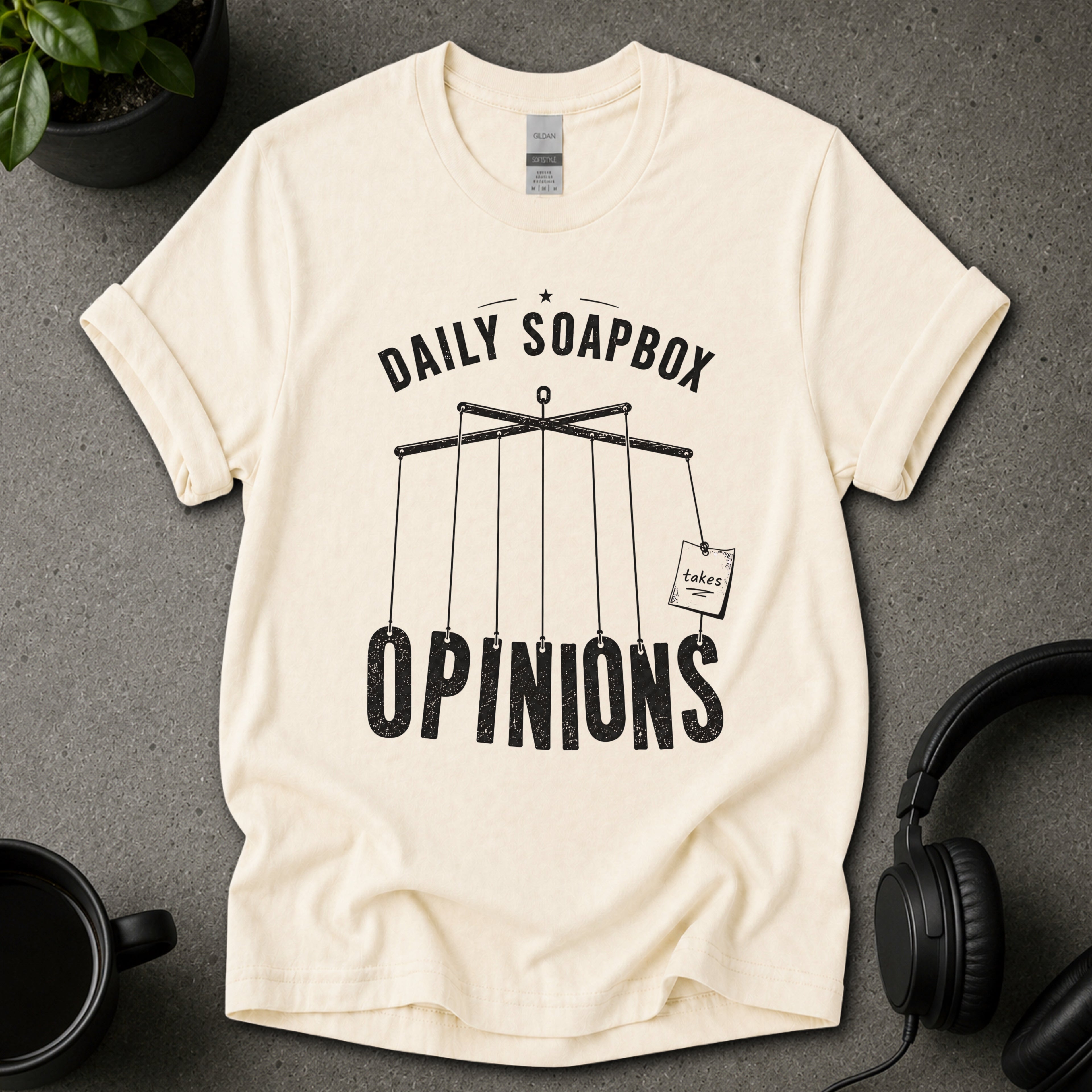 Natural beige graphic T-shirt with Daily Soapbox Opinions text and hanging opinion sign illustration