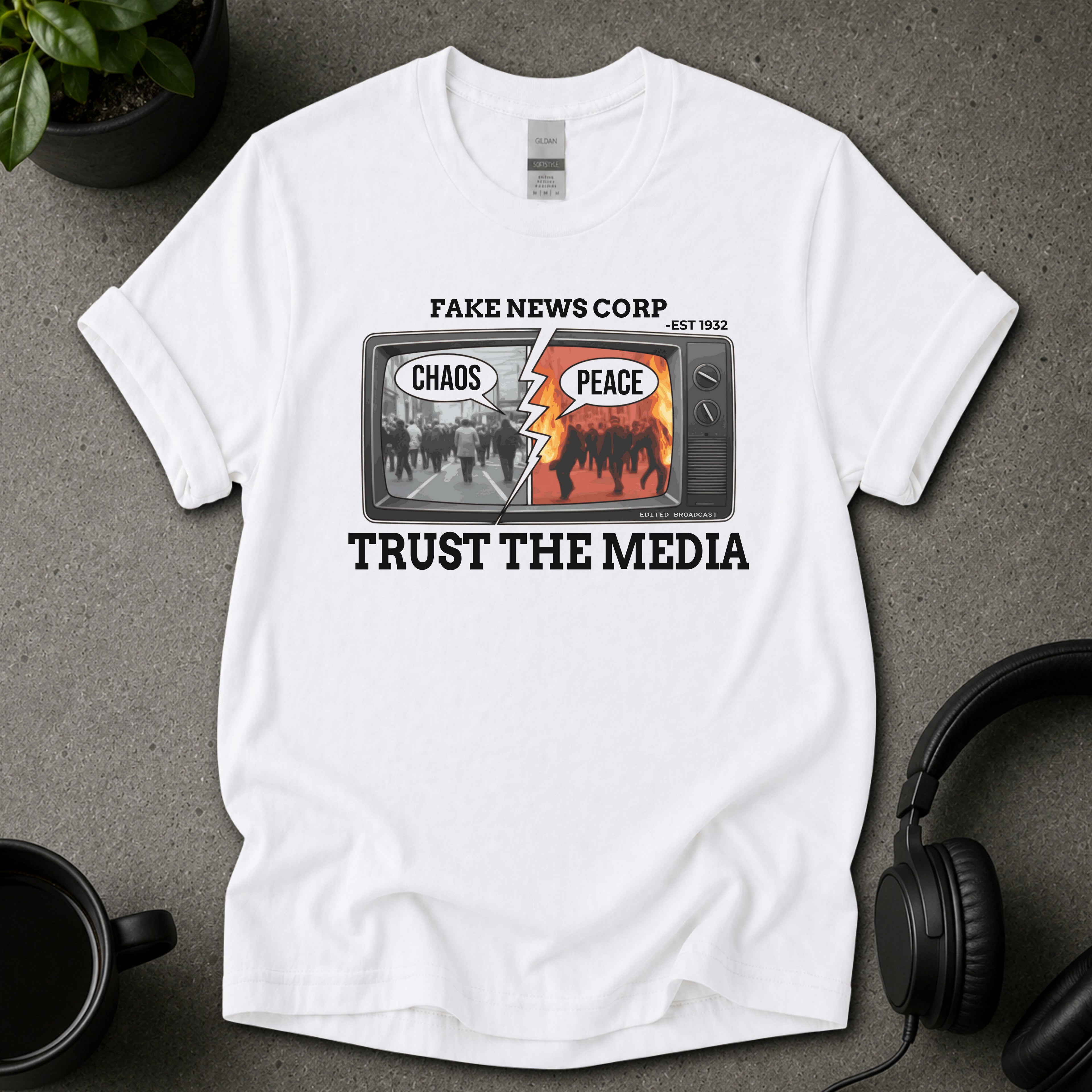 Fake News Corp satirical media graphic T-shirt design with retro television, chaos and peace speech bubbles, and Trust The Media text.
