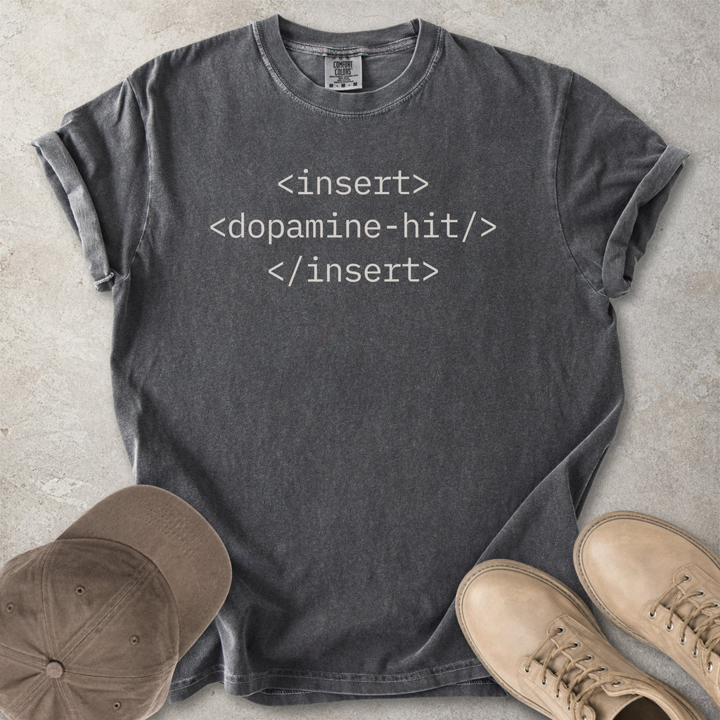 Grey Comfort Colors graphic T-shirt with grey HTML-style text reading insert dopamine hit, styled with brown cap and tan boots