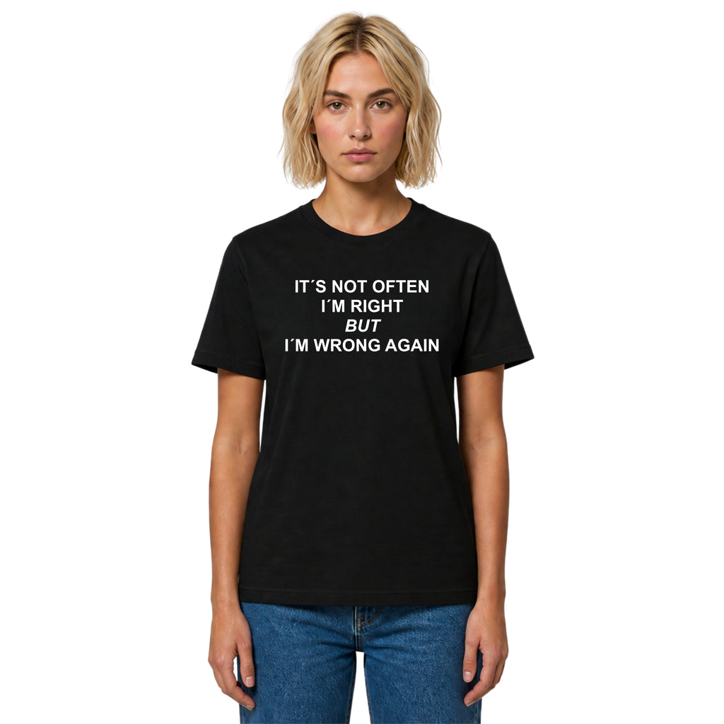 Person wearing a black t-shirt with text on a white background