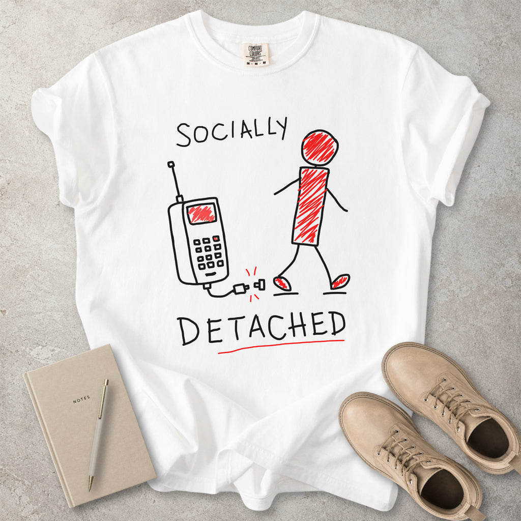 White Comfort Colors graphic T-shirt with hand-drawn socially detached design showing a person walking away from an unplugged phone, styled with straw hat and red flip flops