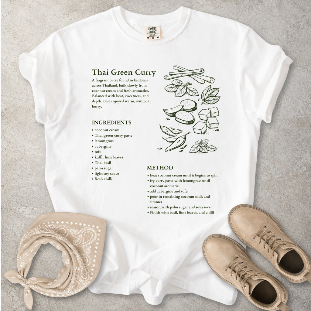 White Comfort Colors graphic T-shirt with Thai green curry recipe text, ingredients list, method and food illustration, styled with tan bandana and boots