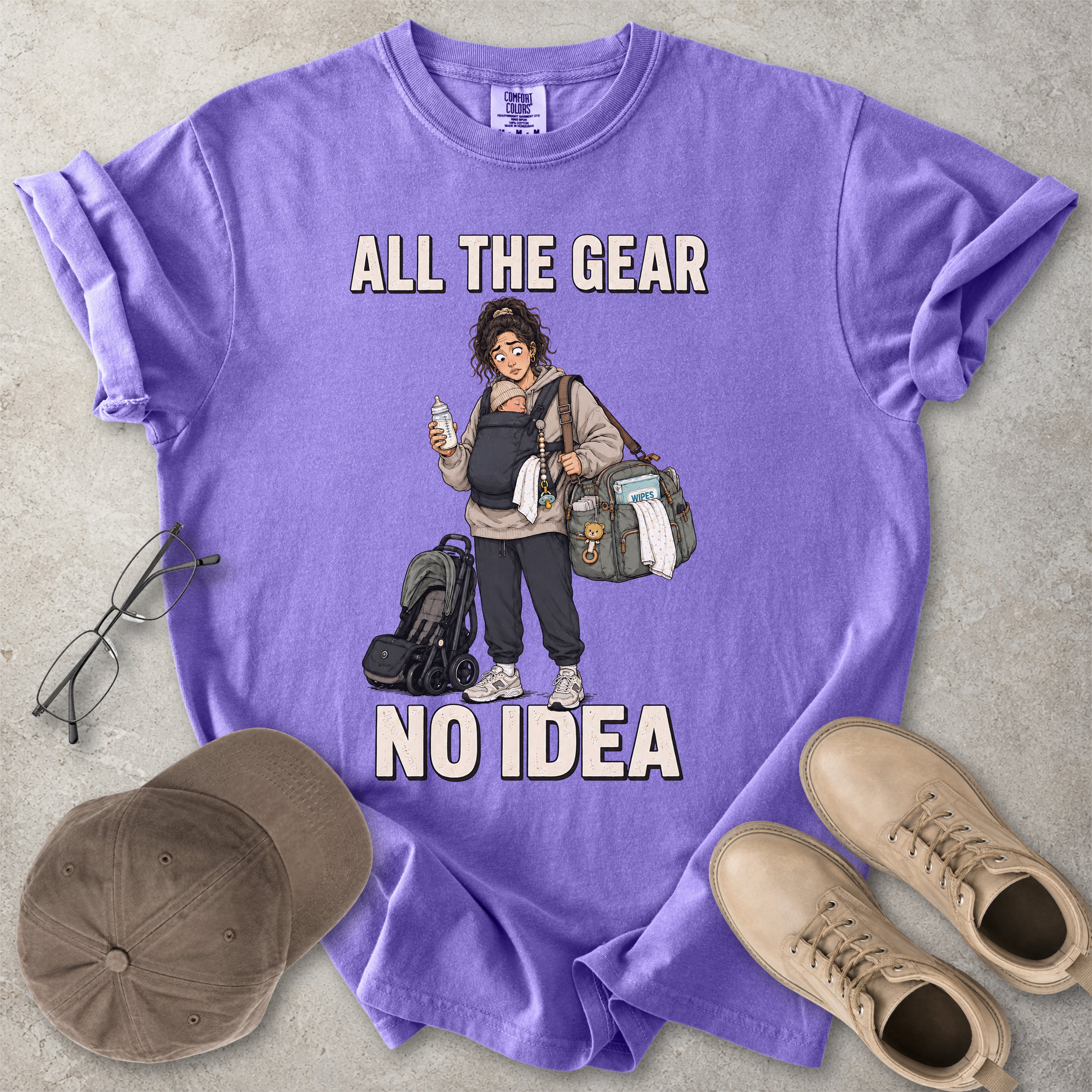 Violet purple Comfort Colors 1717 T-shirt with a funny All the Gear No Idea new mum graphic showing a tired mother carrying a baby, bottle, changing bag and stroller.