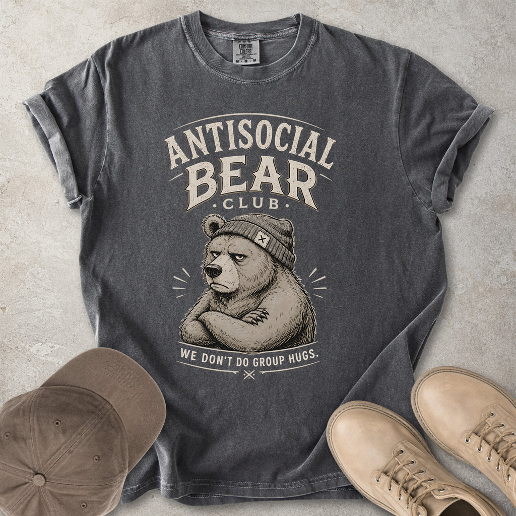 Gray t-shirt with 'Antisocial Bear Club' graphic, accompanied by a cap and shoes on a textured surface.