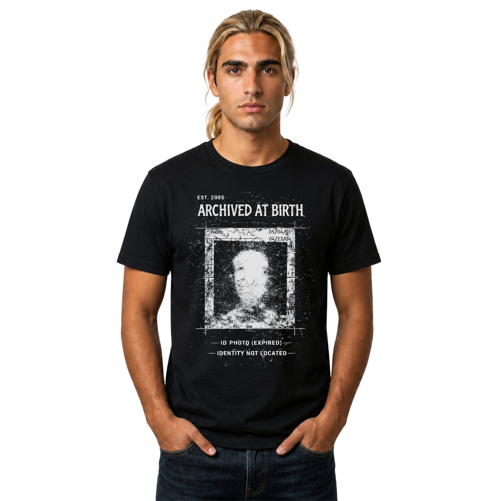 Black graphic T-shirt featuring Archived At Birth text, corrupted ID photo artwork, distressed archive texture and dark grunge design.