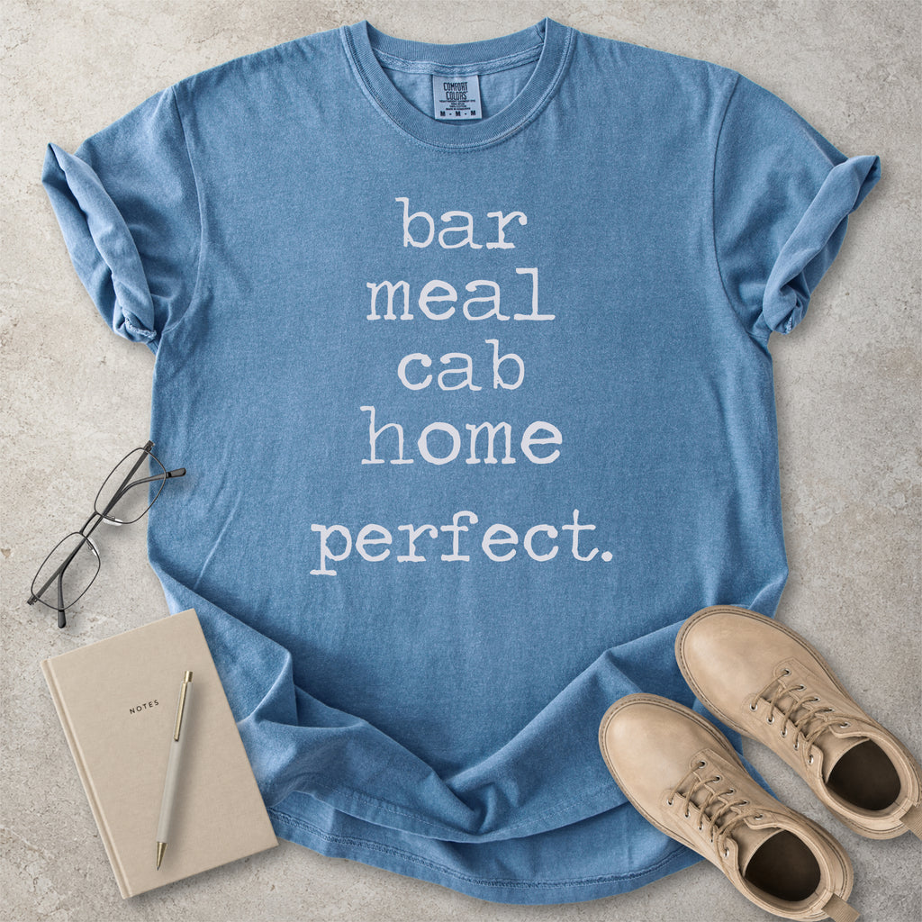 Blue jean Comfort Colors graphic T-shirt with white text reading bar meal cab home perfect, styled with black boots and a black bandana