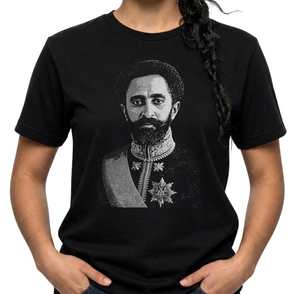 Person wearing a black t-shirt with a graphic of a historical figure.