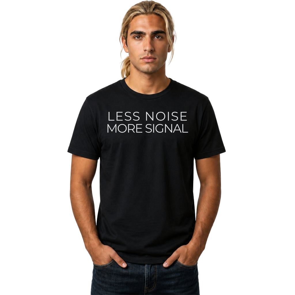 Man wearing a black t-shirt with 'LESS NOISE MORE SIGNAL' text on a white background