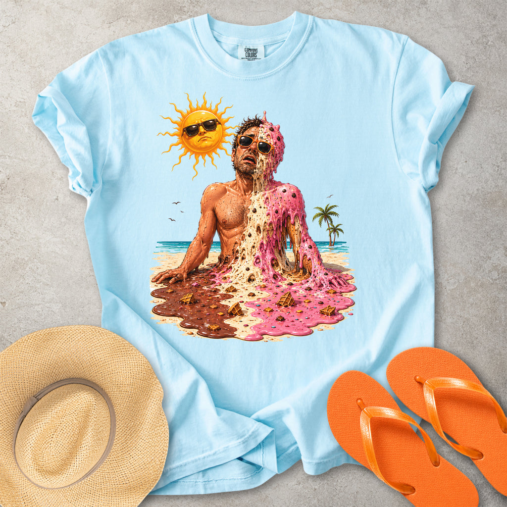 Light blue Comfort Colors graphic T-shirt with a melting ice cream man on a sunny beach, styled with straw hat and orange flip flops