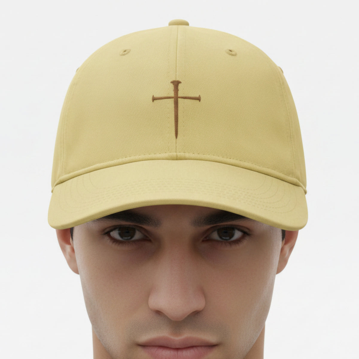 Model wearing the Nail Cross Cap in Butter (pale yellow) — nail cross, crucifixion, Comfort Colors CCWC0 washed christian cap