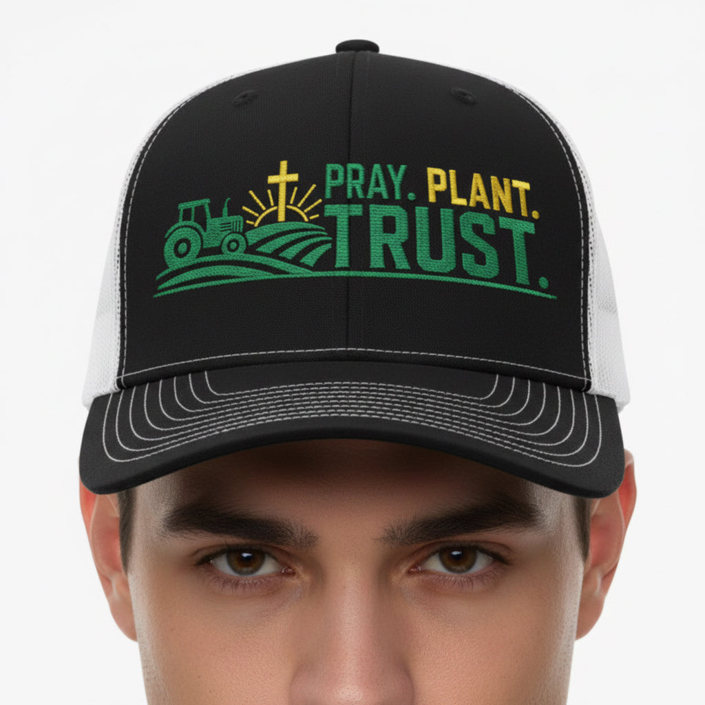 Model wearing the Pray Plant Trust Trucker Cap in Black / White — pray plant trust, farmer, Richardson 112 christian trucker cap