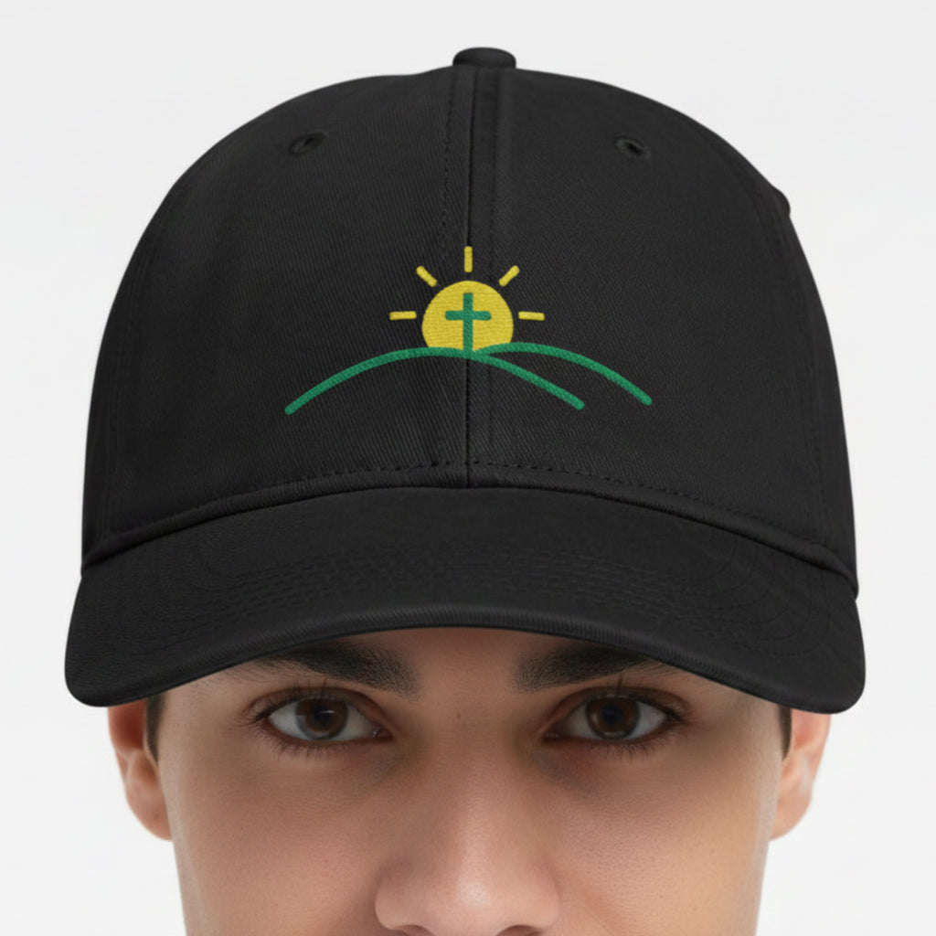 Model wearing the Sun And Cross Cap in Black — sunrise cross, new day, Comfort Colors CCWC0 washed christian cap