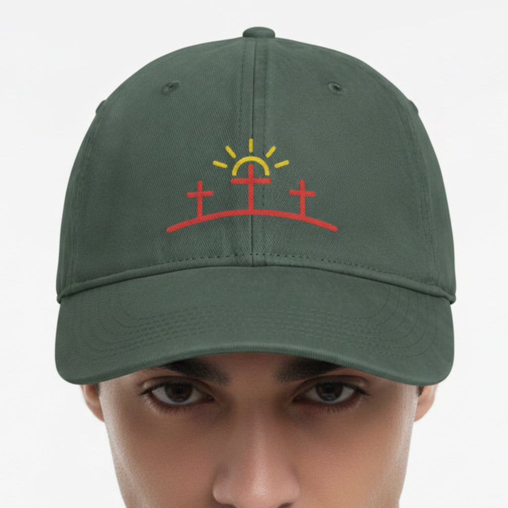 Model wearing the Three Crosses Sunrise Cap in Moss (green) — three crosses, sunrise, Comfort Colors CCWC0 washed christian cap
