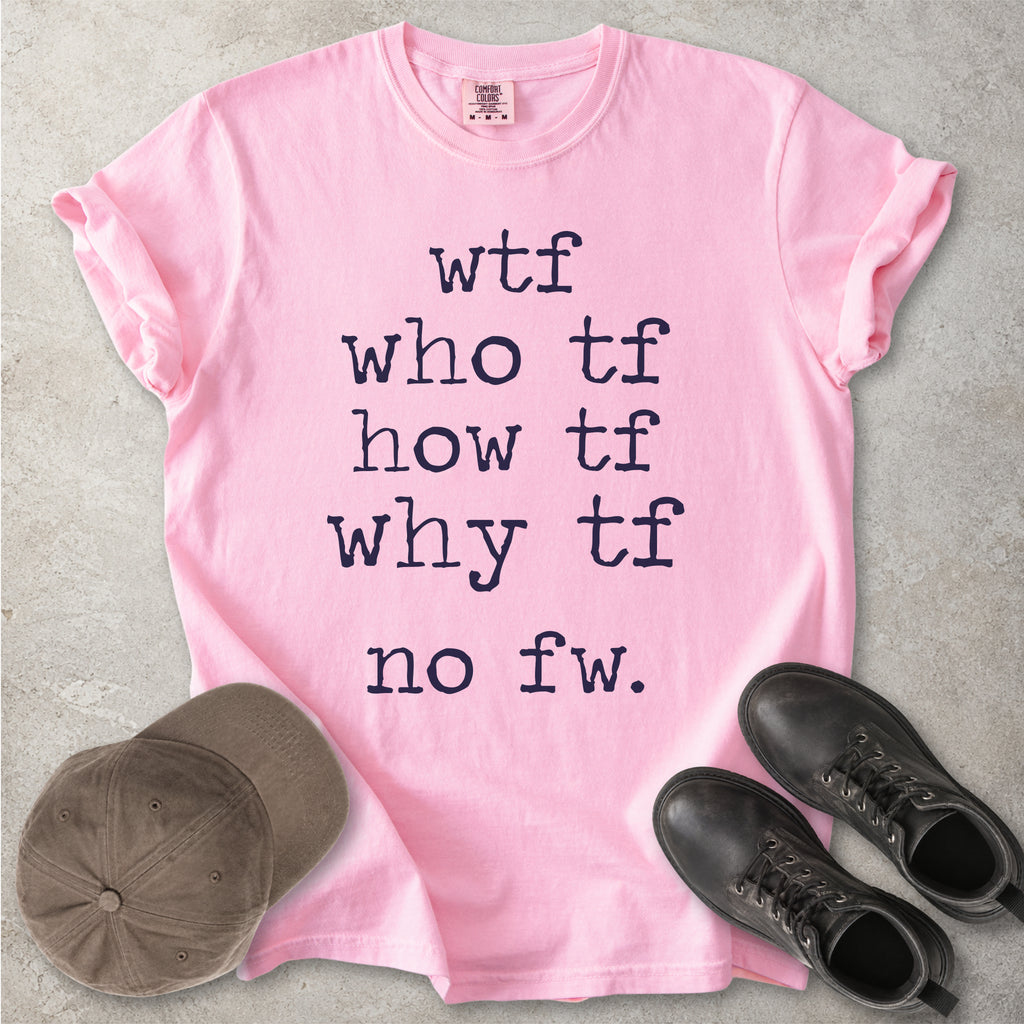 Pink Comfort Colors graphic T-shirt with grey text reading wtf, who tf, how tf, why tf and no fw, styled with a brown cap and black boots