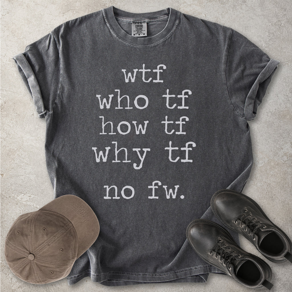 Grey Comfort Colors graphic T-shirt with grey text reading wtf, who tf, how tf, why tf and no fw, styled with a brown cap and black boots